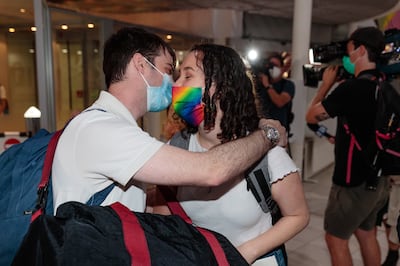 People reunite at Perth Airport in Western Australia after the state reopened its borders to all travel. EPA