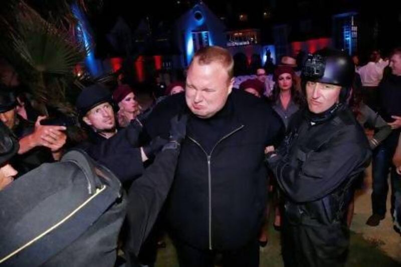 Actors in police costume mock-arrest the Megaupload founder, Kim Dotcom, in Auckland, New Zealand last week. Nigel Marple / Reuters