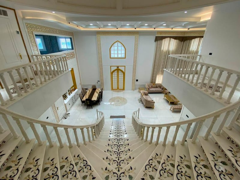 This undated photograph provided by Indian businessman Anand Prakash Chouksey shows the interior of a house resembling India’s iconic Taj Mahal monument built by Chouksey as a residence for him and his wife to live in at Burhanpur, Madhya Pradesh, India.  Constructed with white marble procured from Makrana, a city in Rajasthan state and the same place that gave the Taj Mahal its marble, the smaller imitation embodies several aspects of the real monument, including the large dome, intricate minarets and even artwork seen on the original.  ( Anand Prakash Chouksey via AP)