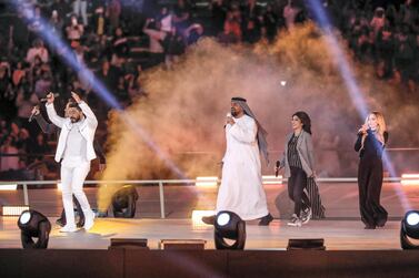 Hussain Al Jassmi, centre, Assala and Avril Lavigne, right, and left Luis Fonsi and Tamer Hosny as they performed Special Olympics anthem Right Where I'm Supposed To Be at the World Games Abu Dhabi 2019 on Thursday night. Antonie Robertson / The National