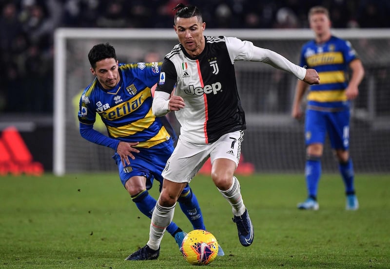 Juventus' Portuguese forward Cristiano Ronaldo outruns Parma's Italian midfielder Matteo Scozzarella. AFP