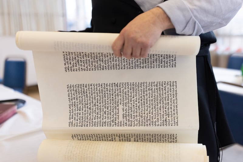 The Scroll of Esther is a firsthand account of the events of Purim - the annual Purim holiday is celebrated by Jewish communities around the world with parades and costume parties. Getty Images