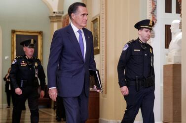 Republican Senator Mitt Romney leaves the Senate floor during a recess in the US Capitol in Washington on Friday. EPA