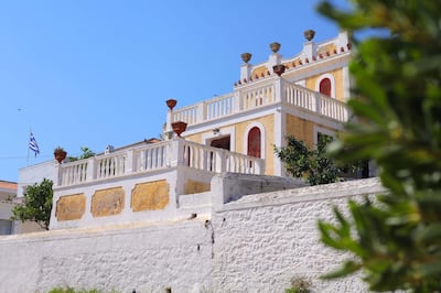 Spetses, Greece - August 15, 2018: Old traditional holiday villa on promenade at Spetses island, Saronic Gulf, Peloponnese, Greece. Getty Images