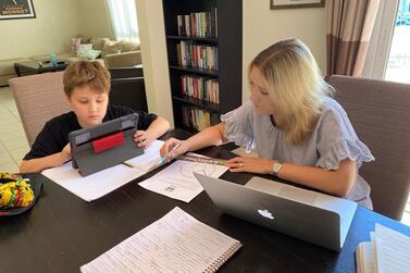 Samantha Armstrong, a British parent in Dubai, helps her nine-year-old son with his e-learning. Courtesy: Samantha Armstrong