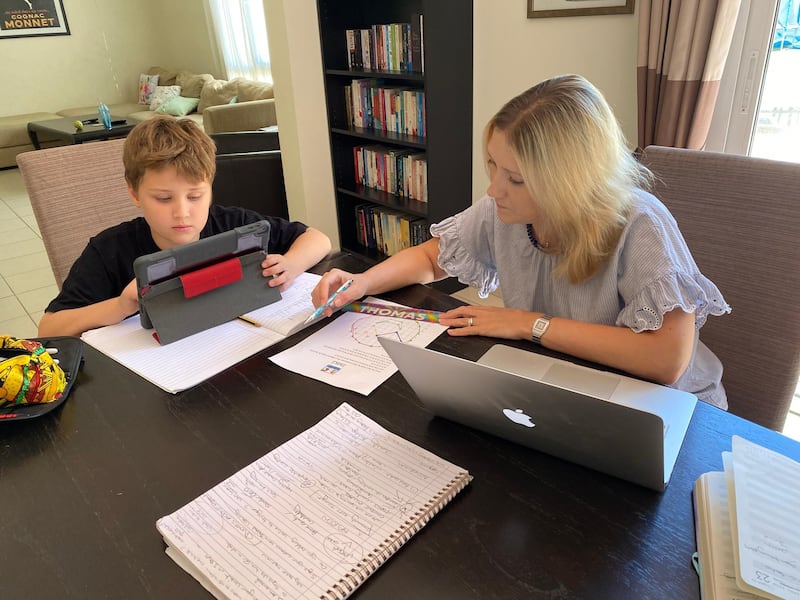 Samantha Armstrong, a British parent in Dubai, helps her nine-year-old son with his e-learning. Courtesy: Samantha Armstrong