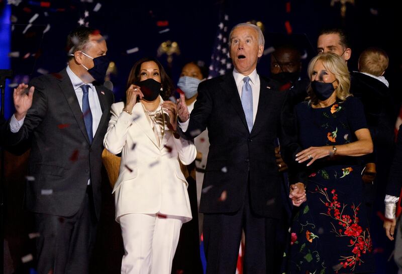 Democratic presidential nominee Joe Biden and his wife Jill, and Democratic vice presidential nominee Kamala Harris and her husband Doug, react to the confetti at their rally in Wilmington, Delaware. Reuters