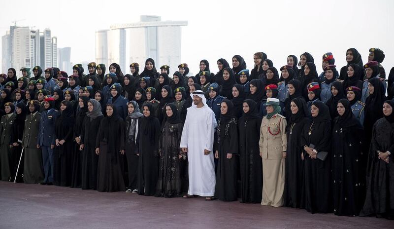 Sheikh Mohammed bin Zayed stands for a photograph with a group of one hundred and fifty women representing local and federal government entities, Abu Dhabi Police and the Armed Forces in celebration of Emirati Women’s Day, during a Sea Palace barza. Seen with Reem Al Hashimi, Minister of State for International Cooperation (5th L), Najla Al Awar, Minister of Community Development (6th L), Sheikha Lubna Al Qasimi, Minister of State for Tolerance (8th L), Jameela Al Muhairi, Minister of State for Public Education Affairs (9th L), Dr Maitha Al Shamsi, Minister of State (10th L) and Dr Amal Al Qubaisi, Speaker of the Federal National Council (FNC) (11th L). Rashed Al Mansoori / Crown Prince Court - Abu Dhabi