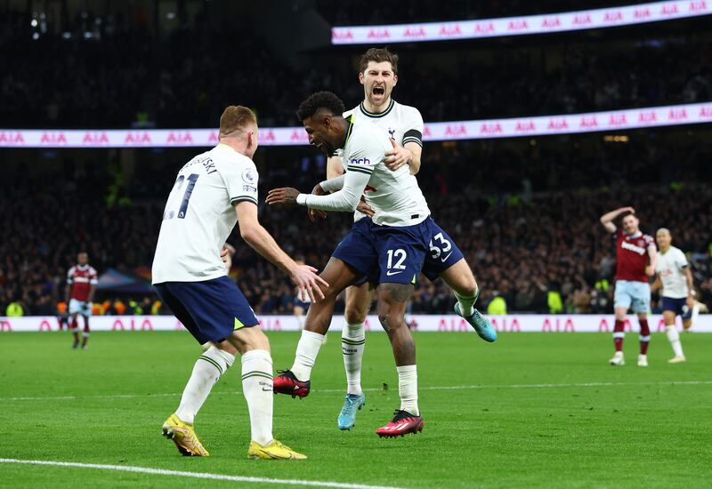 Tottenham's Emerson Royal celebrates scoring their first goal with Ben Davies and Dejan Kulusevski. Reuters