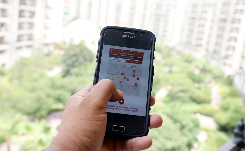 epa06034700 An Indian woman uses the Donor on Call (DoC) mobile phone app in New Delhi, India, 18 June 2017. The apps helps people to find matching blood group donors on call and also donors can easily registered themselves with DoC after installing the app. Donor on Call mobile app is a technology based humanitarian service where matching blood group donors are located nearby the recipient’s blood bank on 'real time location' basis. The objective is to minimize response time, reduce blood storage and refrigeration needs. As a result, saving precious blood from being wasted post expiry date.  EPA/HARISH TYAGI