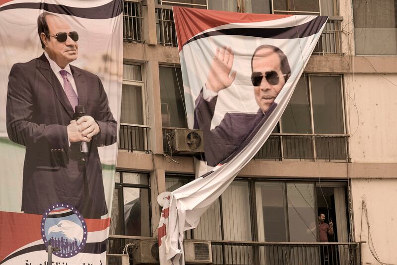 Adverts bearing President El Sisi's face and slogans in support of his third term have sprung up all over Cairo. AP