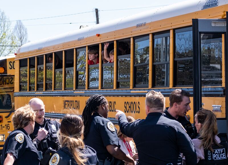 School buses take children to Woodmont Baptist Church to be reunited with their families. Getty / AFP