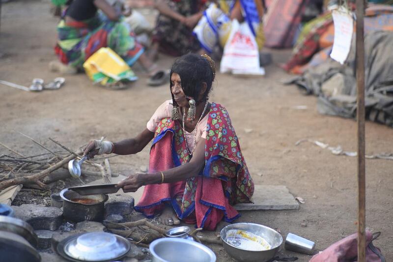 Anusha Jadhav cooks her evening meal of rice and dal in the camp at Ghatkopar on the outskirts of north Mumbai. Subhash Sharma for The National