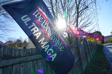 Flags supporting former President Donald Trump flutter in the breeze on the road leading into Mt.  Holly Springs, Pa. , on Tuesday, Oct.  31, 2023.  The town is in Cumberland County, where Trump beat President Joe Biden by around 25 percentage points in 2020.  (AP Photo/Allen G.  Breed)