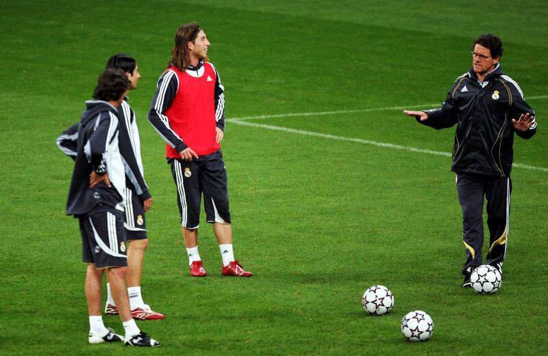 MUNICH, GERMANY - MARCH 06: Coach Fabio Capello (R) talks to his players during the Real Madrid training session at the Allianz Arena, on March 6, 2007 in Munich, Germany. Bayern Munich will face Real Madrid in the UEFA Champions League round of sixteen at the Allianz Arena on March 7, in Munich.  (Photo by Sandra Behne/Bongarts/Getty Images)
