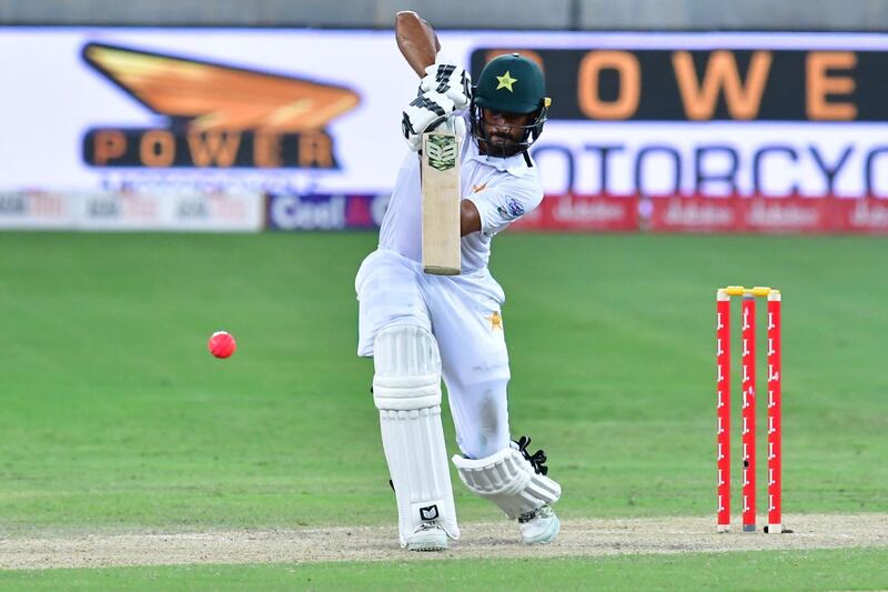 This photograph taken Ocotber 7, 2017 shows Shan Masood of Pakistan playing a shot during the second day of the second Test cricket match between Sri Lanka and Pakistan at Dubai International Stadium in Dubai. / AFP PHOTO / GIUSEPPE CACACE