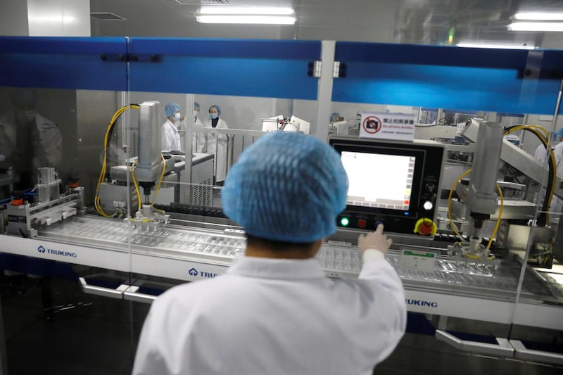 A staff member works next to the production line. Reuters