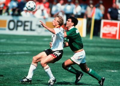 CHICAGO, UNITED STATES - JUNE 17: Juergen Klinsmann of Germany and Gustavo Quinteros of Bolivia in action during the World Cup match between Germany and Bolivia on June 17, 1994 in Chicago, United States.  (Photo by Beate Mueller/Bongarts/Getty Images)