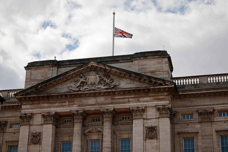 The Union Flag flies at half-mast atop Buckingham Palace. AFP