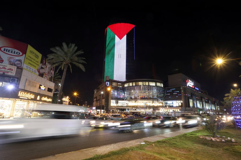 A shopping mall in Baghdad is illuminated with the Palestinian flag in solidarity with those in Gaza. Reuters