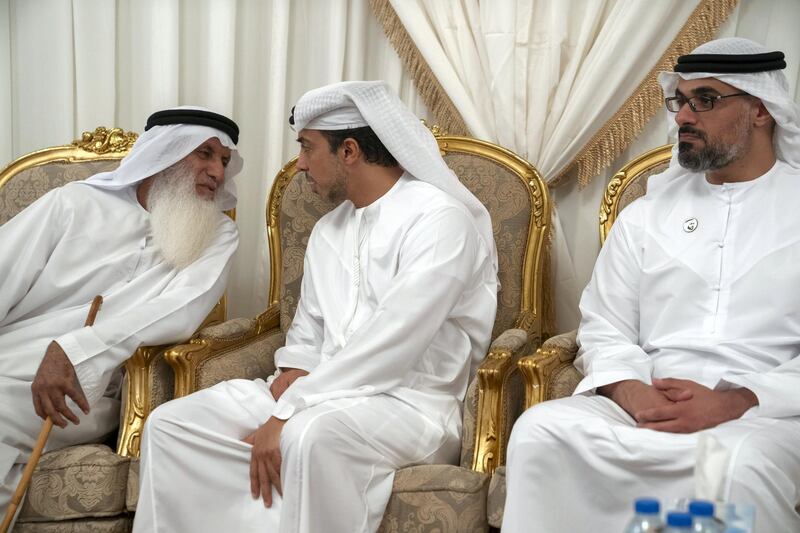 AL AIN, ABU DHABI, UNITED ARAB EMIRATES - September 16, 2019: HH Sheikh Mansour bin Zayed Al Nahyan, UAE Deputy Prime Minister and Minister of Presidential Affairs (C) and HH Major General Sheikh Khaled bin Mohamed bin Zayed Al Nahyan, Deputy National Security Adviser (R), offer condolences to the family of martyr Warrant Officer Nasser Mohamed Hamad Al Kaabi.

( Eissa Al Hammadi for Ministry of Presidential Affairs )
---