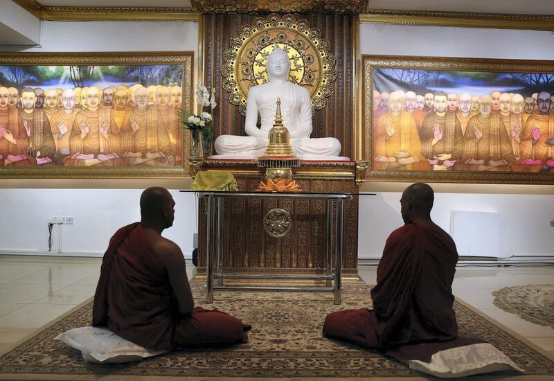 Dubai, United Arab Emirates - August 1, 2018: Two Buddhist priests meditate. Buddhist temple, Mahamevnawa Bhavana Asapuwa. This is the only Buddhist temple in Dubai. Wednesday, August 1st, 2018 in Jumeirah, Dubai. Chris Whiteoak / The National