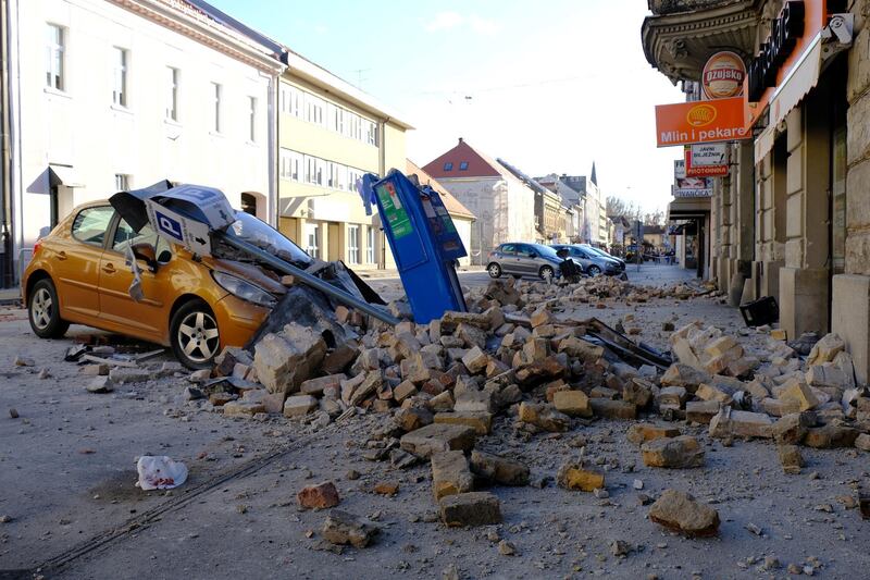 A destroyed car is seen on a street after an earthquake in Sisak, Croatia.  REUTERS