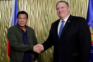 Philippine President Rodrigo Duterte greetingUS Secretary of State Mike Pompeo at Villamor Air Base south-east of Manila. AP