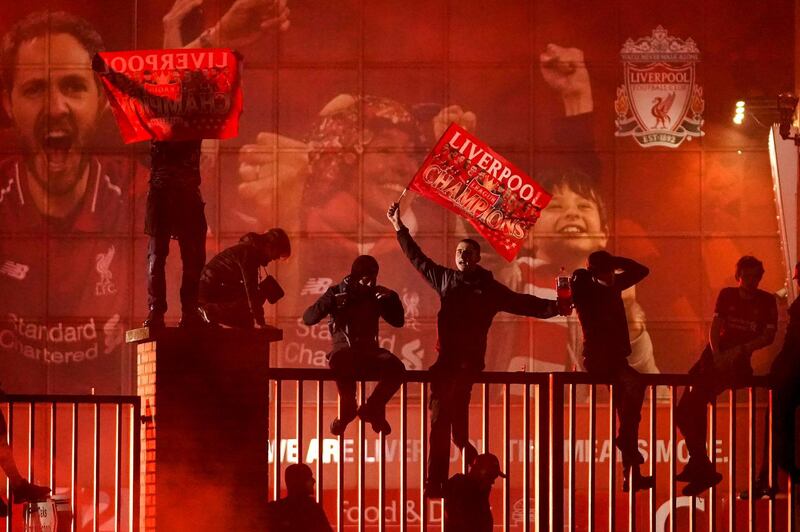 Fans celebrate outside Anfield. Getty
