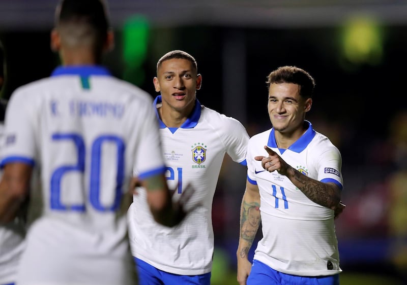 Brazil's Philippe Coutinho celebrates scoring his second goal against Bolivia. The Barcelona playmaker had earlier opened the scoring from the penalty spot. Brazil wom the match in Sao Paulo 3-0. Reuters
