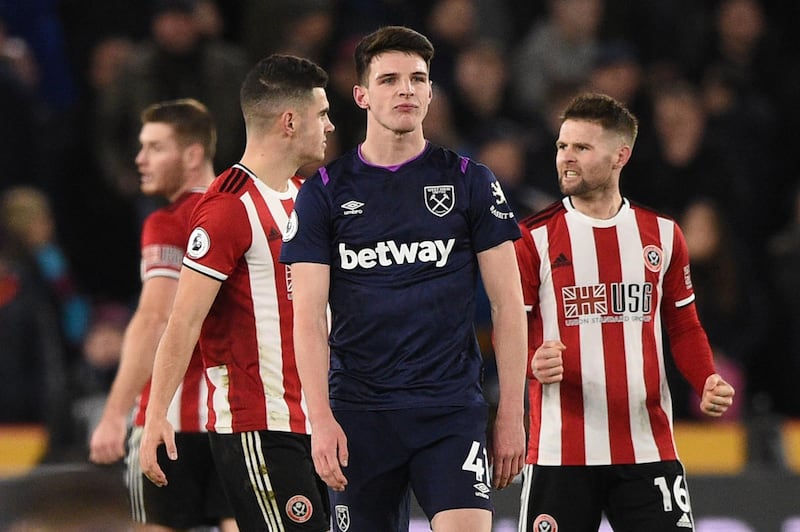 West Ham midfielder Declan Rice looks dejected after a 1-0 defeat to Sheffield United. AFP