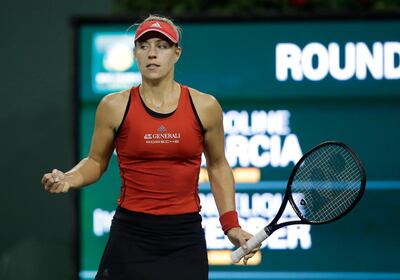 epa06602236 Angelique Kerber of Germany in action against Caroline Garcia of France during the BNP Paribas Open tennis tournament at the Indian Wells Tennis Garden in Indian Wells, California, USA, 13 March 2018.  EPA/PAUL BUCK