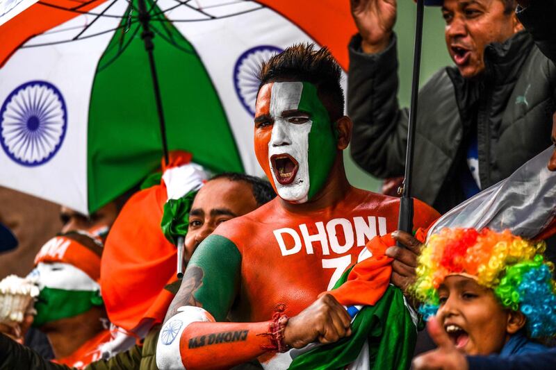 A cricket fan painted with the colours of the Indian national flag on his body cheers during the first one day international (ODI) cricket match of a three-match series between India and South Africa at Himachal Pradesh Cricket Association Stadium in Dharamsala on March 12, 2020. ----IMAGE RESTRICTED TO EDITORIAL USE - STRICTLY NO COMMERCIAL USE-----
 / AFP / Sajjad  HUSSAIN / ----IMAGE RESTRICTED TO EDITORIAL USE - STRICTLY NO COMMERCIAL USE-----
