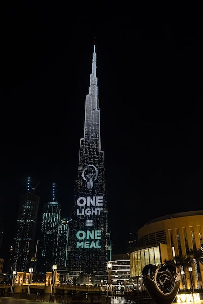 The World’s Tallest Donation Box secured 1.2 million meals through community donations, one meal for every light purchased on the Burj Khalifa. AP 