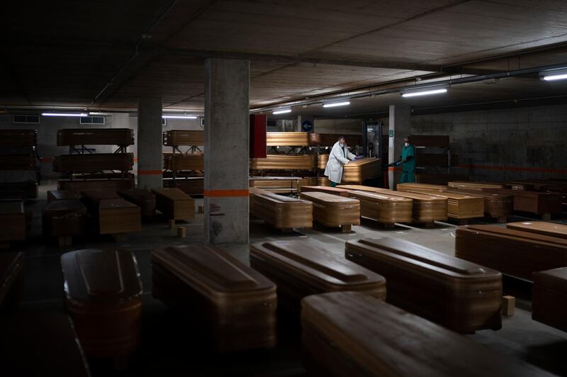 Coffins carrying the bodies of people who died of coronavirus are stored waiting to be buried or incinerated in an underground parking lot at the Collserola funeral home in Barcelona, Spain, April 2, 2020. AP