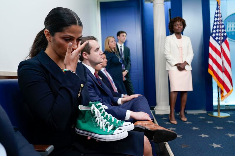 Camila Alves McConaughey holds the lime green Converse tennis shoes that were worn by Uvalde shooting victim Maite Yuleana Rodriguez. AP