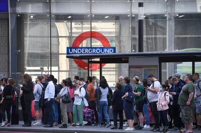 Commuters wait at a bus stop near London Victoria railway station. 'London’s infrastructure is creaking under the weight of its population,' says Andrew Carter, the chief executive of Centre for Cities. Bloomberg