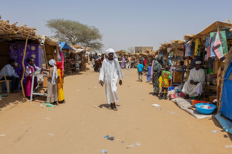 A man walks in the market of the Adre refugee camp
