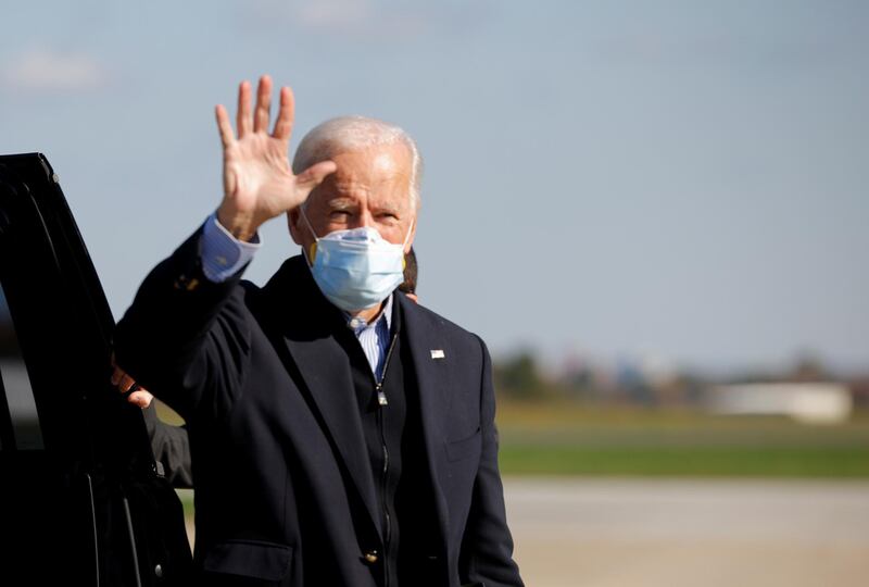 Democratic U.S. presidential nominee and former Vice President Joe Biden gestures at the airport in Flint, Michigan, U.S. Reuters