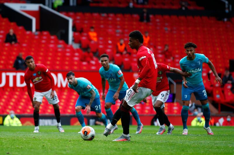 Manchester United's Marcus Rashford scores from the penalty spot. AP