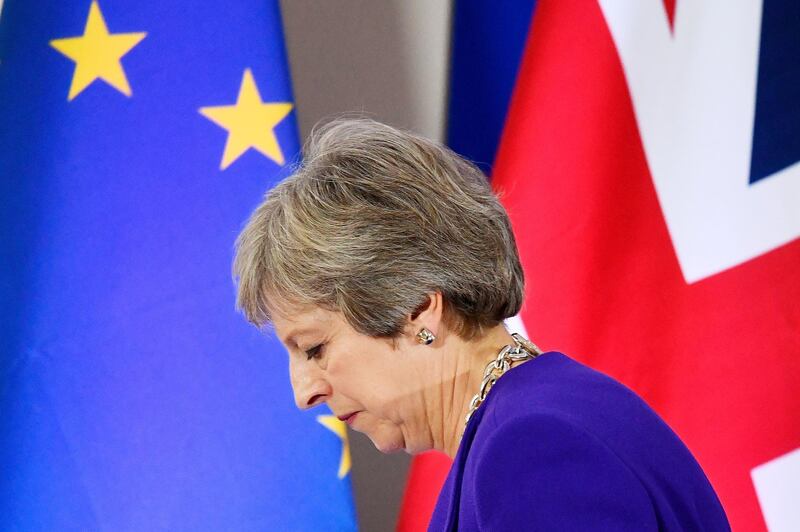 FILE PHOTO: Britain's Prime Minister Theresa May leaves a news conference at the European Union leaders summit in Brussels, Belgium October 18, 2018. REUTERS/Toby Melville/File Photo