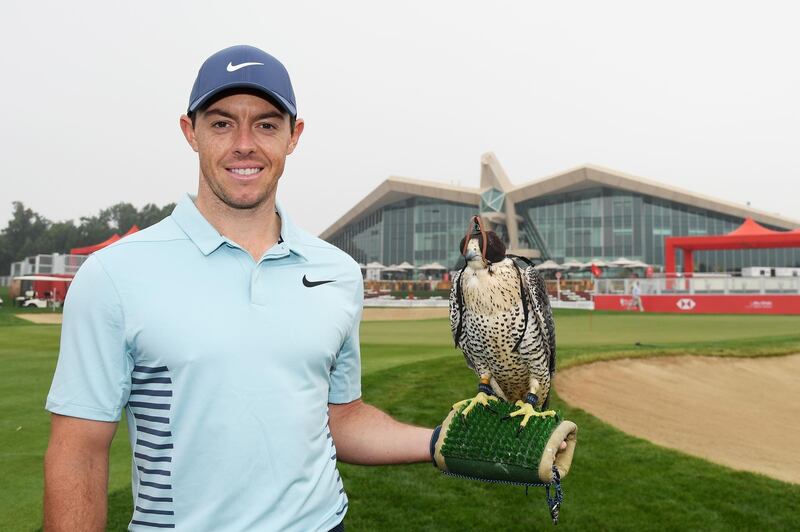 Rory McIlroy poses with a falcon ahead of the Abu Dhabi HSBC Golf Championship. Ross Kinnaird / Getty Images