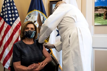 US Speaker of the House Nancy Pelosi receives the Pfizer-BioNTech COVID-19 vaccine from Dr Brian Monahan, Washington, DC, December 18, 2020. Pool via REUTERS 