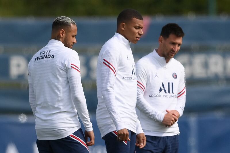 Paris Saint-Germain stars Neymar (L), Kylian Mbappe (C) and new signing Lionel Messi take part in a training session in Saint-Germain en Laye, near Paris. EPA