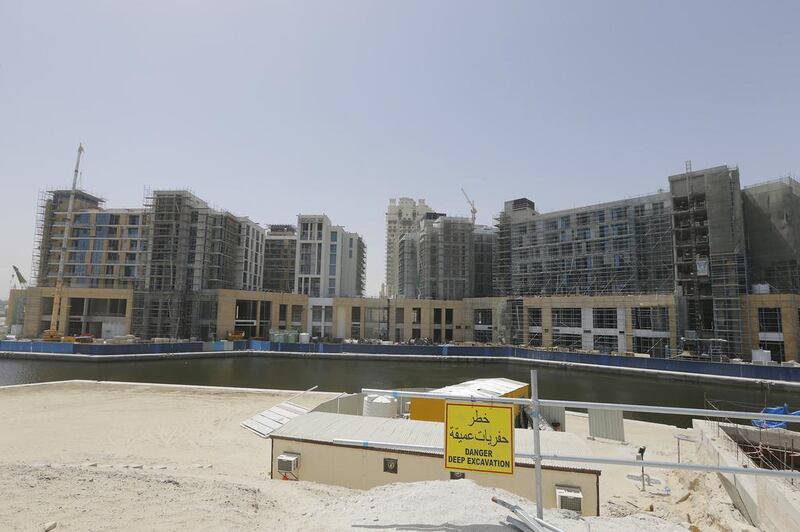 In the UAE, real estate investment trusts are increasingly considered an attractive prospect for individual investors. Jeffrey E Biteng / The National