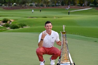 Rory McIlroy of Northern Ireland poses with the DP World Tour Championship trophy during final round of the DP World Tour Championship at Jumeirah Golf Estates in Dubai on November 20,2022.  (Photo by Ryan LIM  /  AFP)