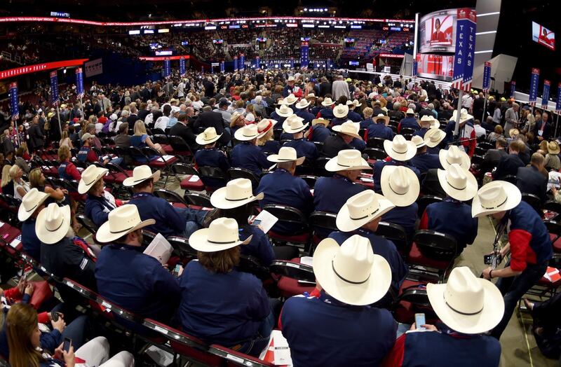 (FILES) In this file photo taken on July 18, 2016 Texas Delegates on the first day of the Republican National Convention at the Quicken Loans Arena in Cleveland, Ohio. Houston has canceled the Texas Republican Party's upcoming state convention, planned to be held there in person, the mayor announced June 8, as novel coronavirus cases surge in the major city. / AFP / TIMOTHY A. CLARY
