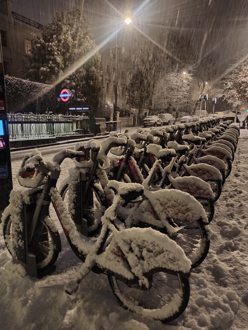 Snow-covered bikes at Warwick Avenue, west London. PA