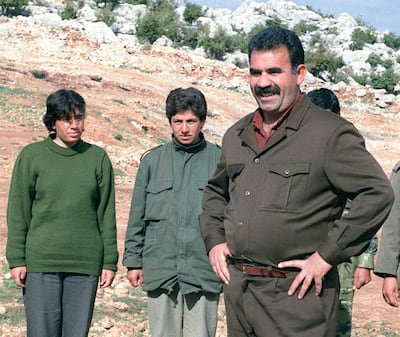 Abdallah Ocalan, right, leader of the PKK, with his guerillas at a training camp in the border village of Helweh, Lebanon. AFP