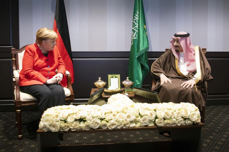 German Chancellor Angela Merkel speaks with King Salman of Saudi Arabia.   Getty